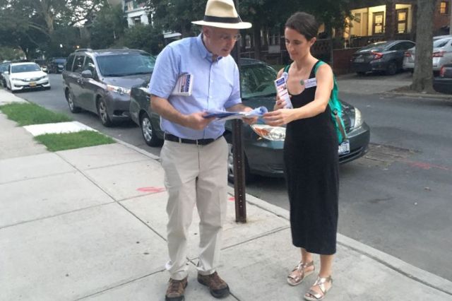 Blake Morris campaigns with volunteer Megan Piontkowski in the 17th State Senate district in Brooklyn.